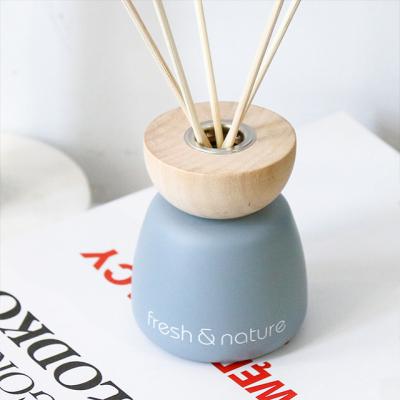 China Fashionalbe Essential Oil Fragrance Aromatherapy Green Pink Frosted Glass Reed Aroma Diffusers With Wooden Cap for sale