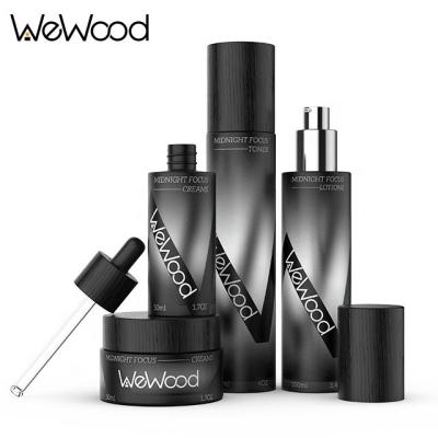 China Custom Fashionalbe Matte Black Wood Cap Empty Skin Care Glass Packaging Sets Cosmetic Bottles for sale