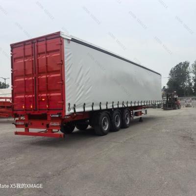 China Jost E100 Landing Gear and Waterproof Tarpaulin 3/4 Axle 40FT Cargo Slide Semi Trailer for sale