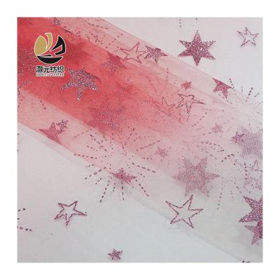 China Breathable Progressive 100% Polyester Printed Girls Dress Red Star Glitter Tulle Fabric Roll for sale