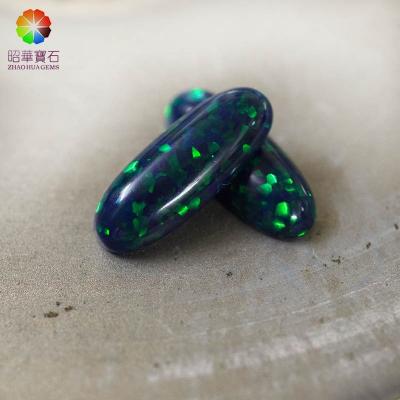 China Star Created Opal Rich Green Color Star Oval Cabochon Toilet Gemstone for sale