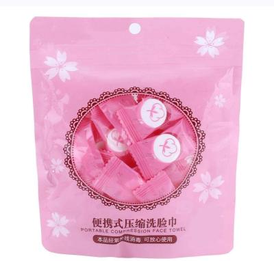 China Makeup Hypoallergenic Disposable Compressed Particle Cotton Travel Portable Face Towel for sale