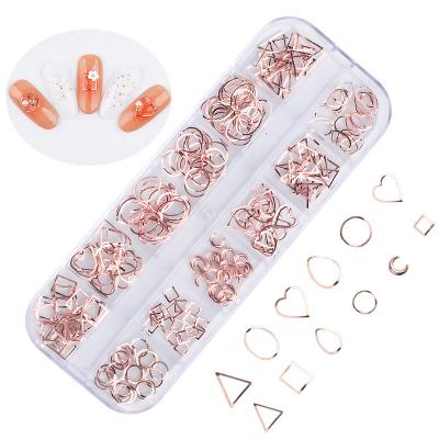 China METAL 12 Grids 3d Metal Rivet Nail Art Decoration Rose Gold Silver Cavity Frame Pearl Jewelry Oval Shell Studs Manicure Accessory for sale