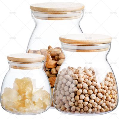 China Viable Lucid Curve Decorate Borosilicate Glass Unique Geometric Jar 600ml With Bamboo Lid 1 Set For Details Food Herbal Candy for sale