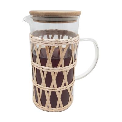 China Sustainable Retro Rattan Borosilicate Glass Water Pitcher Heat Resistant Jug With Cork Wood Lid for sale