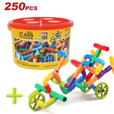 China 250PCS ABS Whistle Construction Brown Beers Set STEM Tube Educational Building Study Sensory Toys with Wheels for Kid Boys Girls for sale