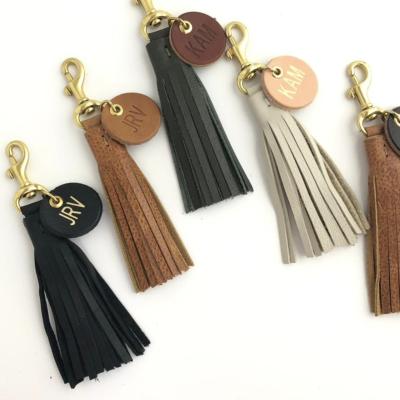 China Custom gold embossed logo customer name key chain of tassel leather bag KALANTA tassel key chain pendant women key chains for sale