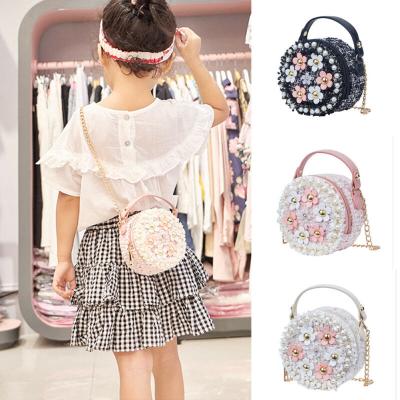 China Lady Children Bag 2021 Winter New Pearl Bag Small Round Messenger Bag Princess Girl Handbag for sale