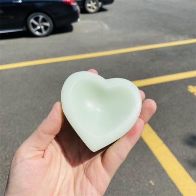 China Dong Hai Wholesale Bulk Natural Polished Luminous Stone Carved Heart Shaped Bowl Healing Crystal Stones Roll On Sale for sale