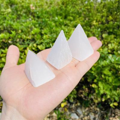 China Dong Hai Folk Handicrafts Selenite Pyramid Tower Caved Transparent Carving Crystals Quartz Healing for sale