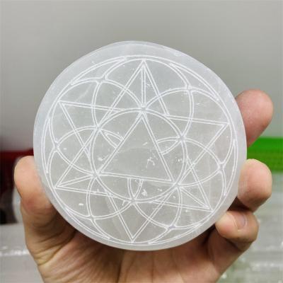 China Dong Hai Wholesale Natural Carved Flower Of Life Pattern Selenite Coaster Slices Than Slab Energy Disc Crystal Protection for sale