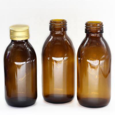 China Pill Syrup Glass Bottle 50ml 100ml Amber Color With Gold Covers For Cough Syrup for sale