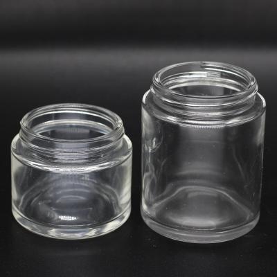 China CBD oil packing 60ml 90ml clear glass jar with child resistant cap for powder cbd flower for sale