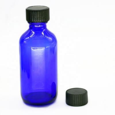 China Elegant Blue Recycable 2 Oz 60 ml Boston Round Glass Bottle With Cone Poly Lined Phenolic Cap for sale