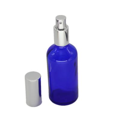 China Personal Care 30ml 50ml Cobalt Blue Glass Perfume Bottle With Silver Aluminum Spray Caps for sale