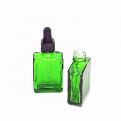 China Personal care 30ml green bottle 1oz rectangle glas dropper bottle with glass eye dropper for perfume for sale