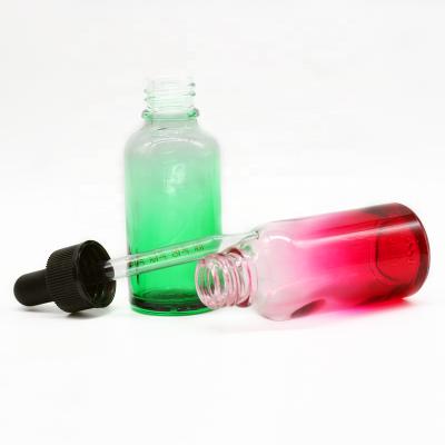 China Eco - Friendly Recyclable Beauty Colorful Faded Green Pink Essential Oil Glass Dropper Bottles for sale