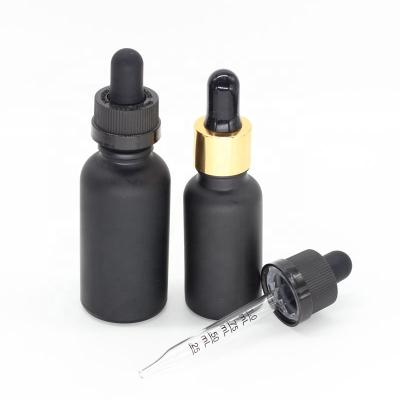 China 30ml pharmaceutical matte black glass bottle with 18mm 20mm gold glass calibrated dropper for sale