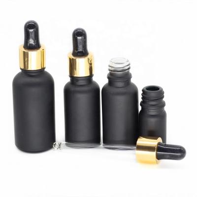 China Euro Cosmetic Packaging 5ml 10ml 15ml 30ml matte black glass dropper bottles with gold glass dropper for sale