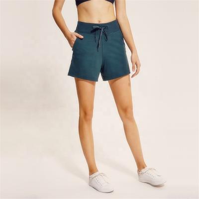 China Loose Elastic Band Gym QUICK DRY Running Logo Women Track Shorts Custom Made With Pocket for sale