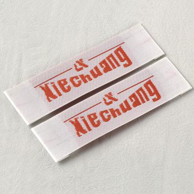 China 2021 Shuttle Machine Satin Woven Label Garment Accessories Soft Touch Viable Wooden Uniform Woven Professional Customization New for sale