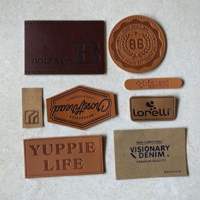 China PU Fade Kraft Paper Sustainable Hot Selling Genuine Leather Mark Metal Label Water Washable Custom Leather Patches for sale