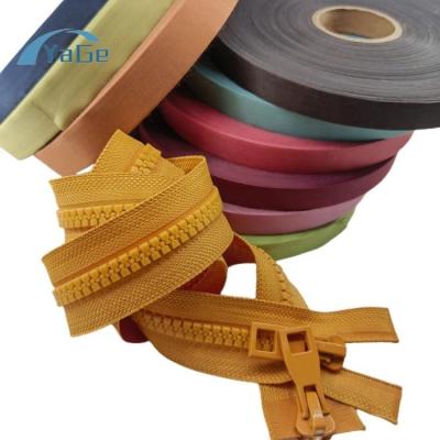 China Viable Hot Melt Glue Fabric Adhesive Zipper Accessories Reinforcing Tape Zipper Fabric Film For Open End Zipper for sale