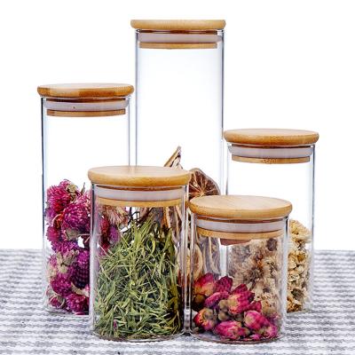 China High Sustainable Borosilicate Glass Candies Thick Sealed Nuts Flavoring Glass Jar With Bamboo Lid Sealing Ring for sale