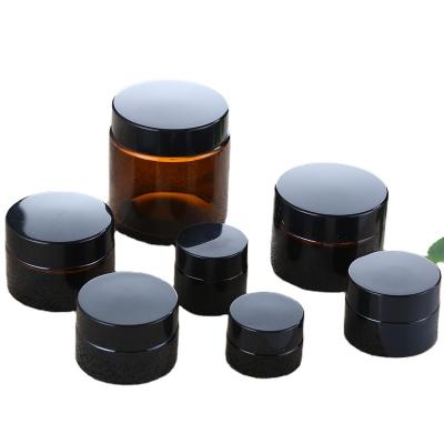 China Custom Personal Care 1Oz 2Oz 4Oz 5G Amber Luxury 10Oz Cosmetic Cream Glass Jar With Black Lids For Sale for sale