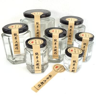 China Wholesale Traditional Mini Glass Jam Jar With Black Metal Lids Around Storage Clear Glass Bottle For Honey In Bulk for sale