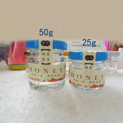 China Eco-friendly Wholesale 25G 50G Small Round Glass Jam Jars Glass Honey Bottles Luxury With Lid Storage Marinate Jar For Food for sale