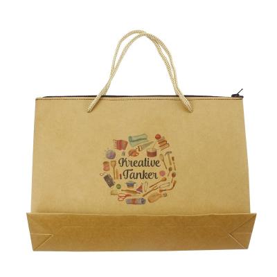 China Handmade Custom Printed Logo Brown Kraft Gift Craft Paper Bag With Handles for sale