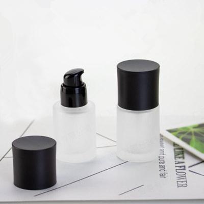 China High Quality Round 30ml Matte Frosted Clear Glass Cosmetics Bottle With Black Lotion Pump for sale