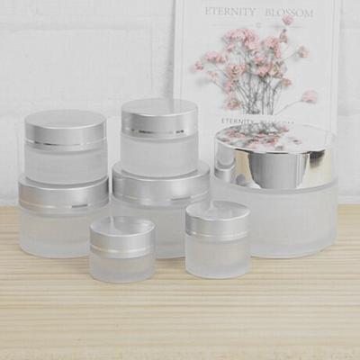 China Skin Care 10g 15g 20g 30g 50g 100g Cream Glass Cosmetic Cream Jar With Silver Lids for sale