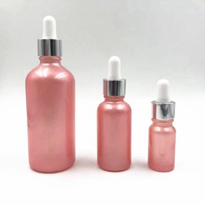 China DIN18 10ml 30ml 100ml euro luxury pink glass dropper bottle with shinny silver glass dropper for sale