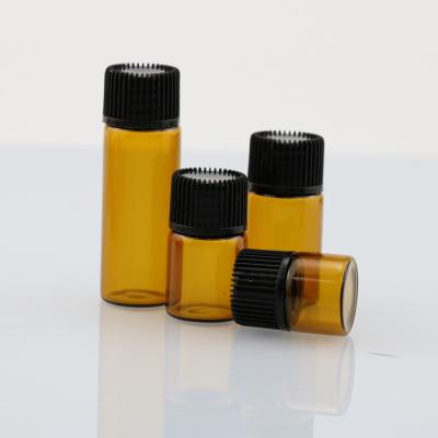 China Personal Care 2ml 3ml 5ml Clear Essential Oil Amber Bottle With Black Cap for sale