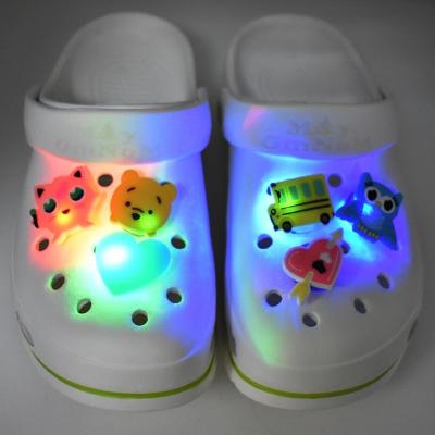 China Clog Charm LED-T Design PVC Rubber Running Transparent Light Up LED Croc Charms Shoe Charms Accessories Flashing Buckles For Clog Shoes for sale