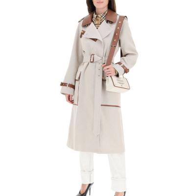 China Anti-wrinkle OEM fashion cotton canvas trench coat with leather finishes cross belted cuffs coat with belt for sale