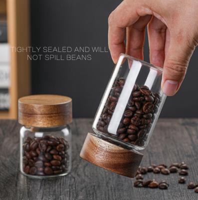 China Q Minimalist Acacia Wood Lid Glass Sealed Jar Coffee Beans Flower Tea Storage Glass Container Kitchen Accessories for sale