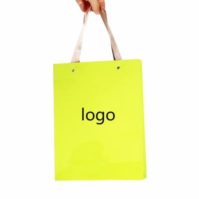 China Recycled Materials Custom Eco Friendly Clothing Retail Bag Packing Pink Paper Gift Bag Shopping Paper Bag With Ribbon Handle for sale