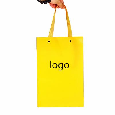 China Recycled Materials Eco Friendly Kraft Packaging Bags Custom Logo Bronzing Retail Shopping Paper With Ribbon Handle For Clothing for sale