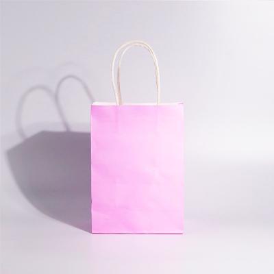 China Recycled Materials Custom pink popular kraft paper bag with your logo for shopping packaging for sale