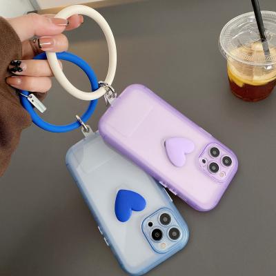 China New Popular Transparent Wrist Strap Female Shockproof Color Love Pendant Ring Phone Case For Iphone 11 12 13 Mobile Phone Shell Cover for sale