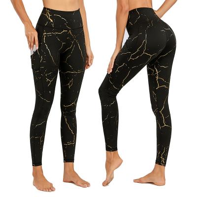 China 2021 breathable new gold printed yoga pants with high waist and belly tucked in black lightning print yoga pants leggings for sale