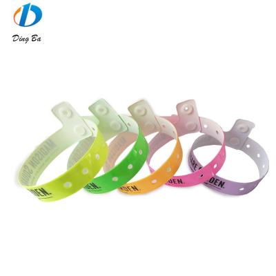 China Custom Logo Printed Vinyl Wristband One Direction Plastic Festival Bracelet for Parks for sale