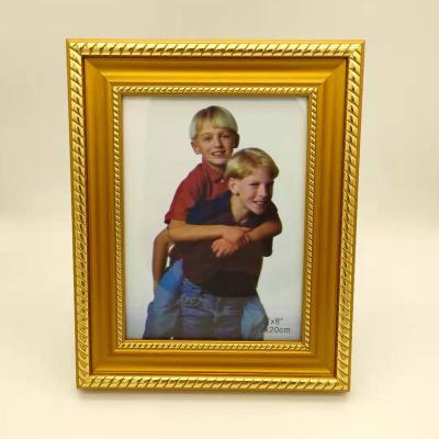 China New Classic Design Gold Fotos Marcos Child Picture Gifts Calssical Wholesale Plastic Memory Table Photo Frame for sale