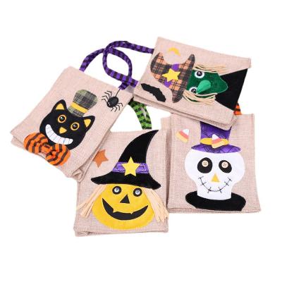 China Factory Wholesale Cheap Eco Friendly Handled Halloween Burlap Gift Jute Bags With Handle In Stock for sale