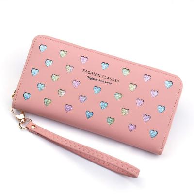 China Anti-theft Cute Heart Cavity Monederos Para Mujer Movable Zipper Around Long Money Clip Female Wallet for sale