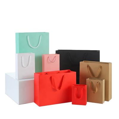 China Recycled Materials Custom Logo Plain Colors Kraft Paper Bag For Shopping And Gift for sale