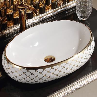 China Art Basin Gold Plated Hand Wash Basin Bathroom Sink Table Wares Ceramic Sanitary Sink Easy Clean Countertop Luxury for sale